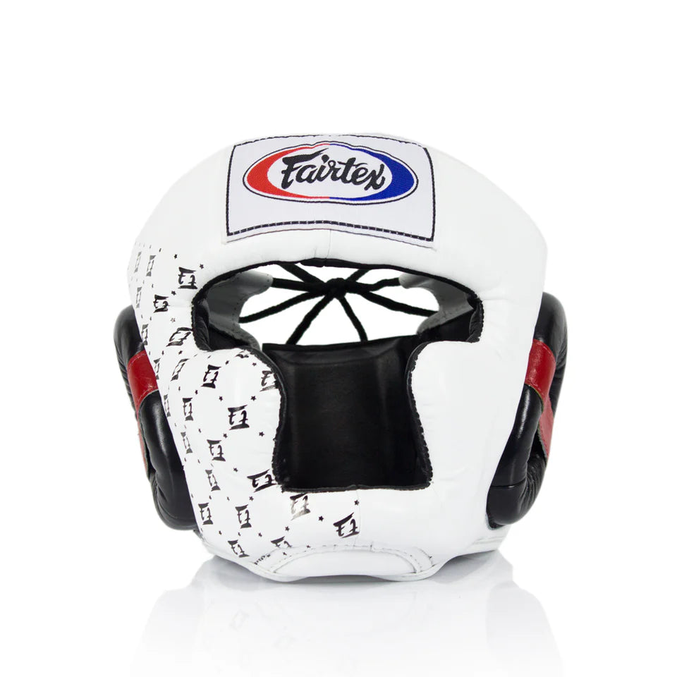 White boxing head gear with black and red accents and Fairtex logo on a white background