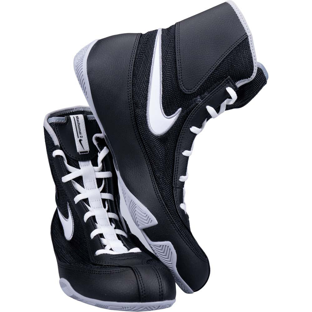 Black and white boxing shoes with a brand logo on a white background