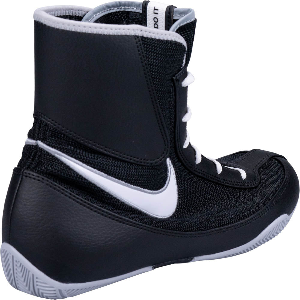 Black and white boxing boot with Nike logo on a white background