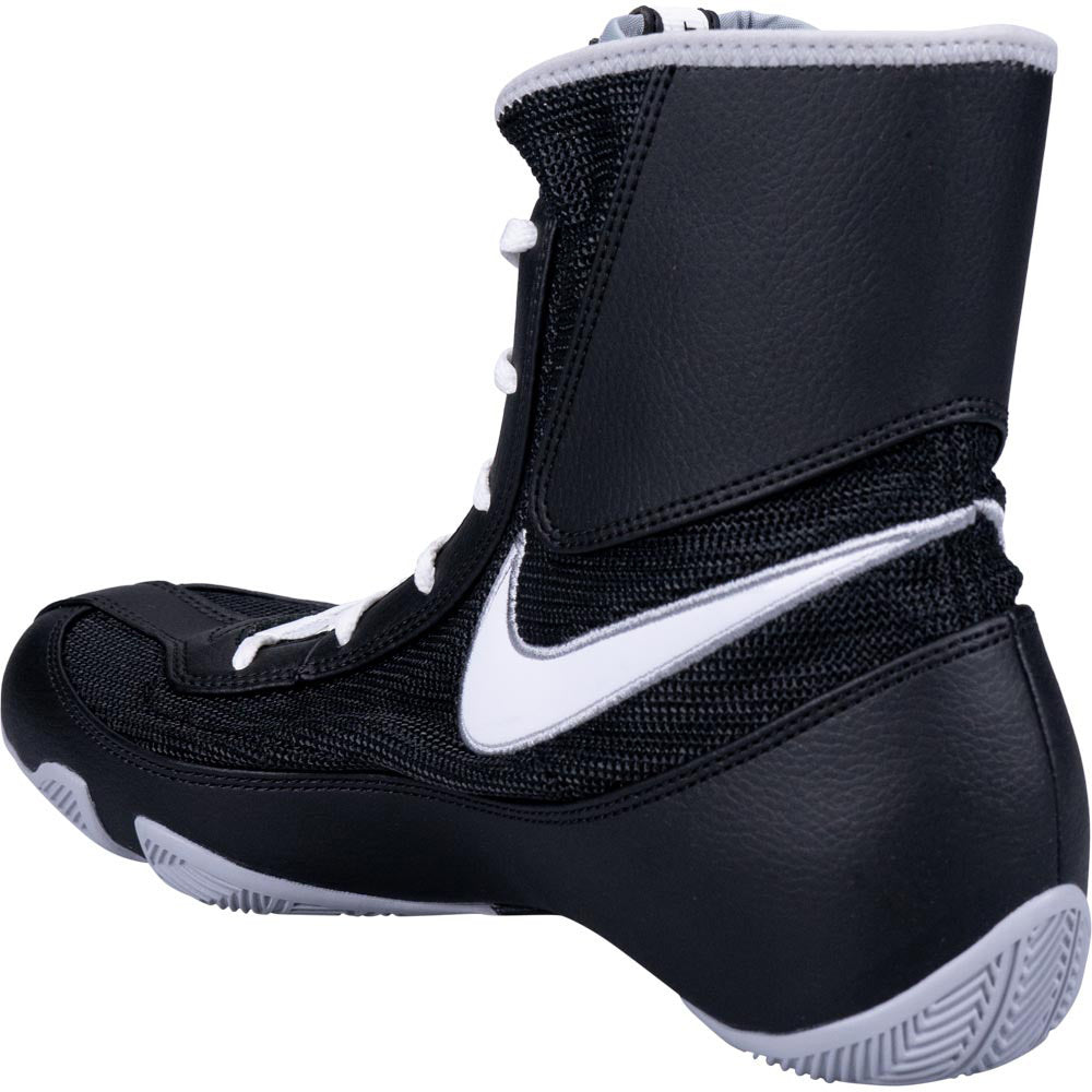 Black boxing boot with white Nike logo on a white background