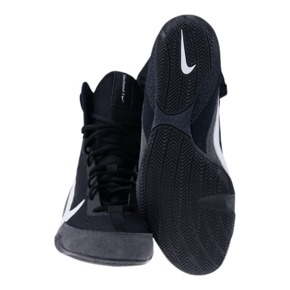 Black and gray athletic boxing shoes with a white logo on a white background