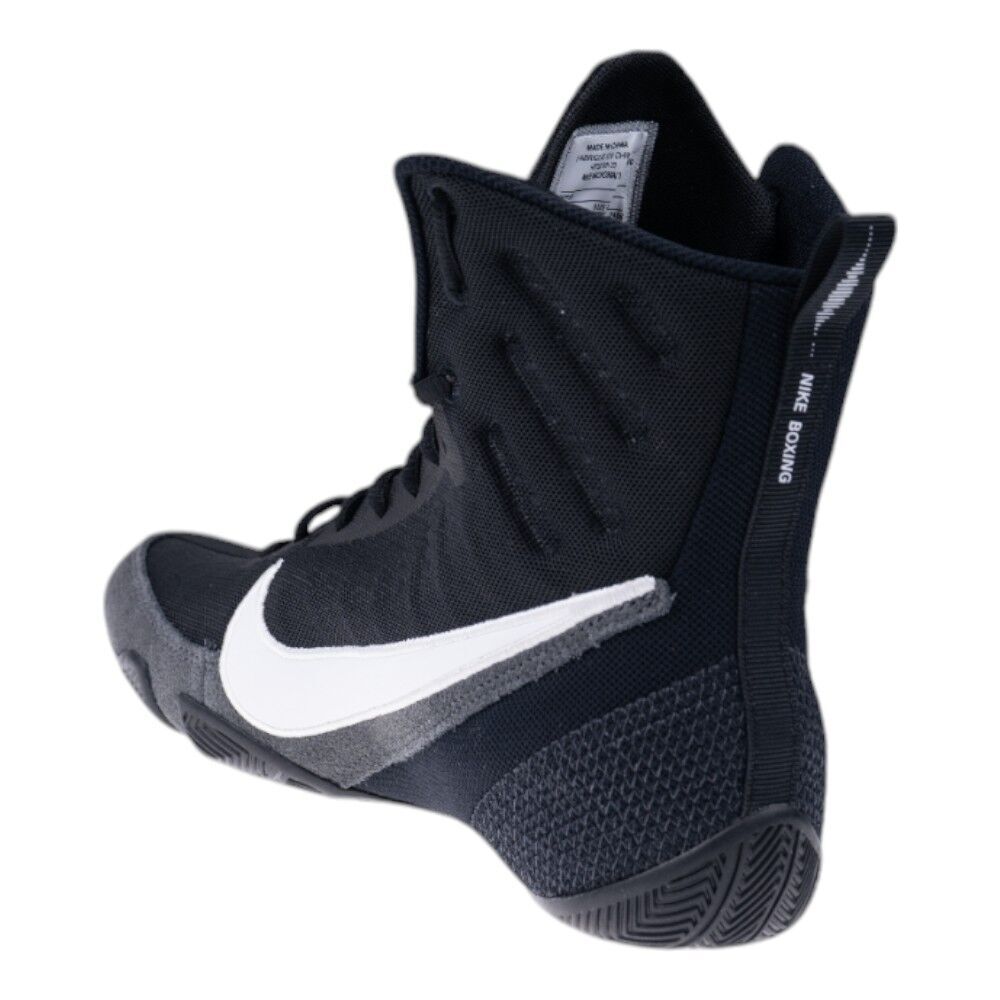 Black Nike boxing shoe with white swoosh logo on a white background