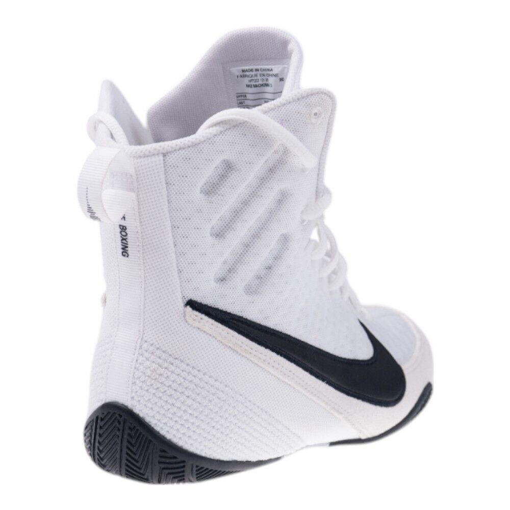 White boxing shoe with black swoosh logo on a white background