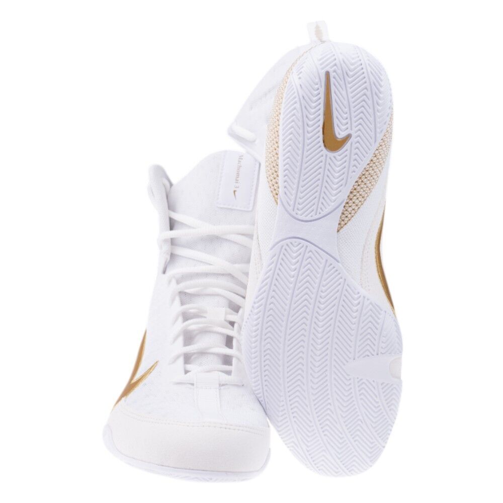 White high-top sneakers with gold accents on a white background