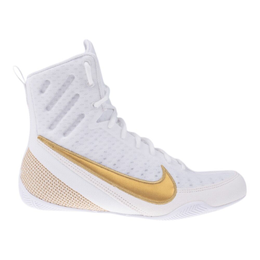 White and gold sneaker with Nike logo on a white background