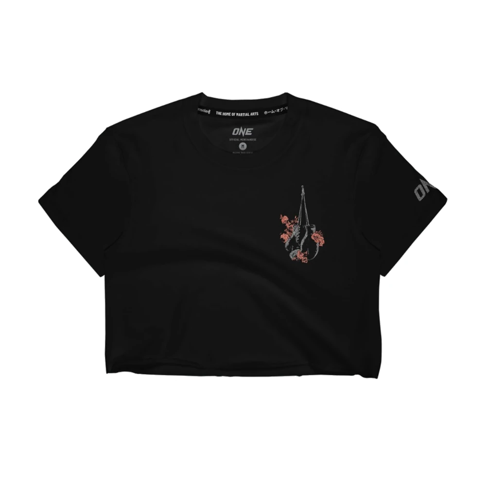 Black t-shirt with a small design on the chest against a white background