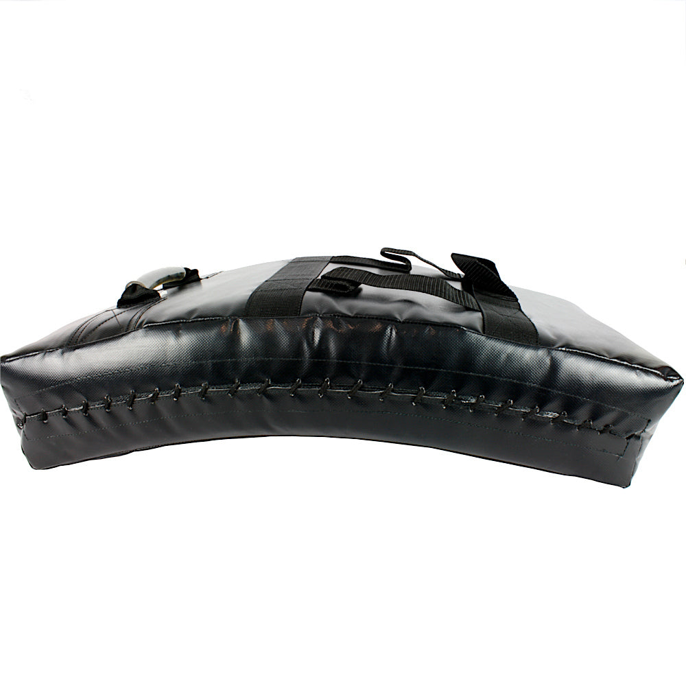 Side profile of a black Muay Thai kick shield