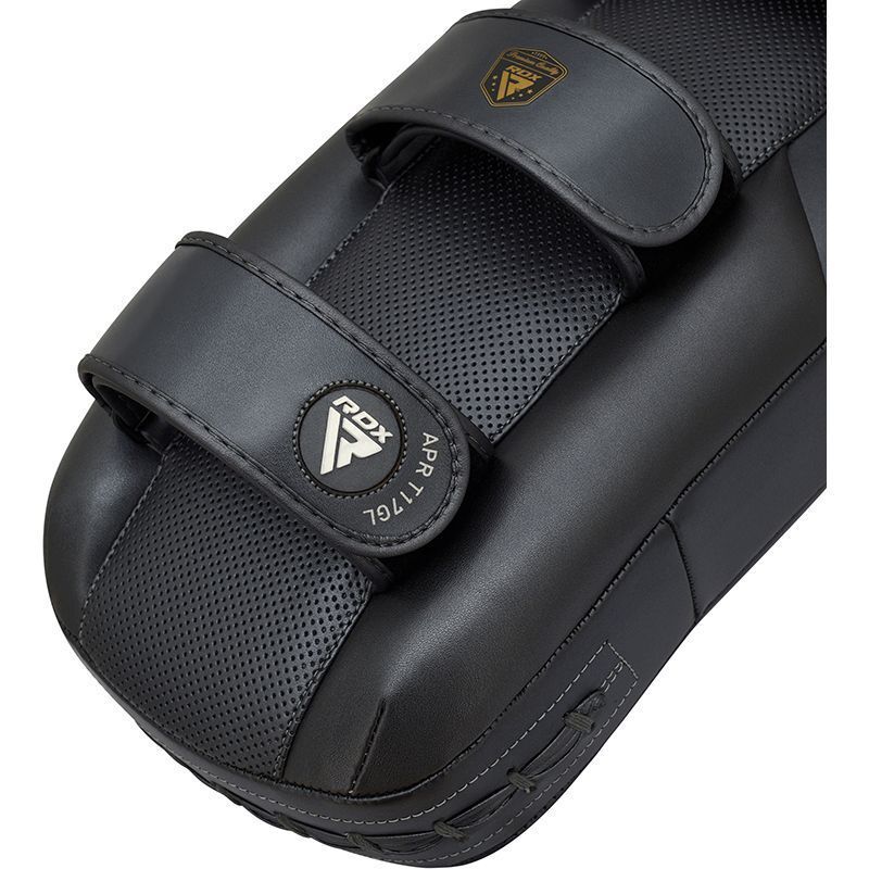Close up of an RDX Thai pads with brand logo on a white background