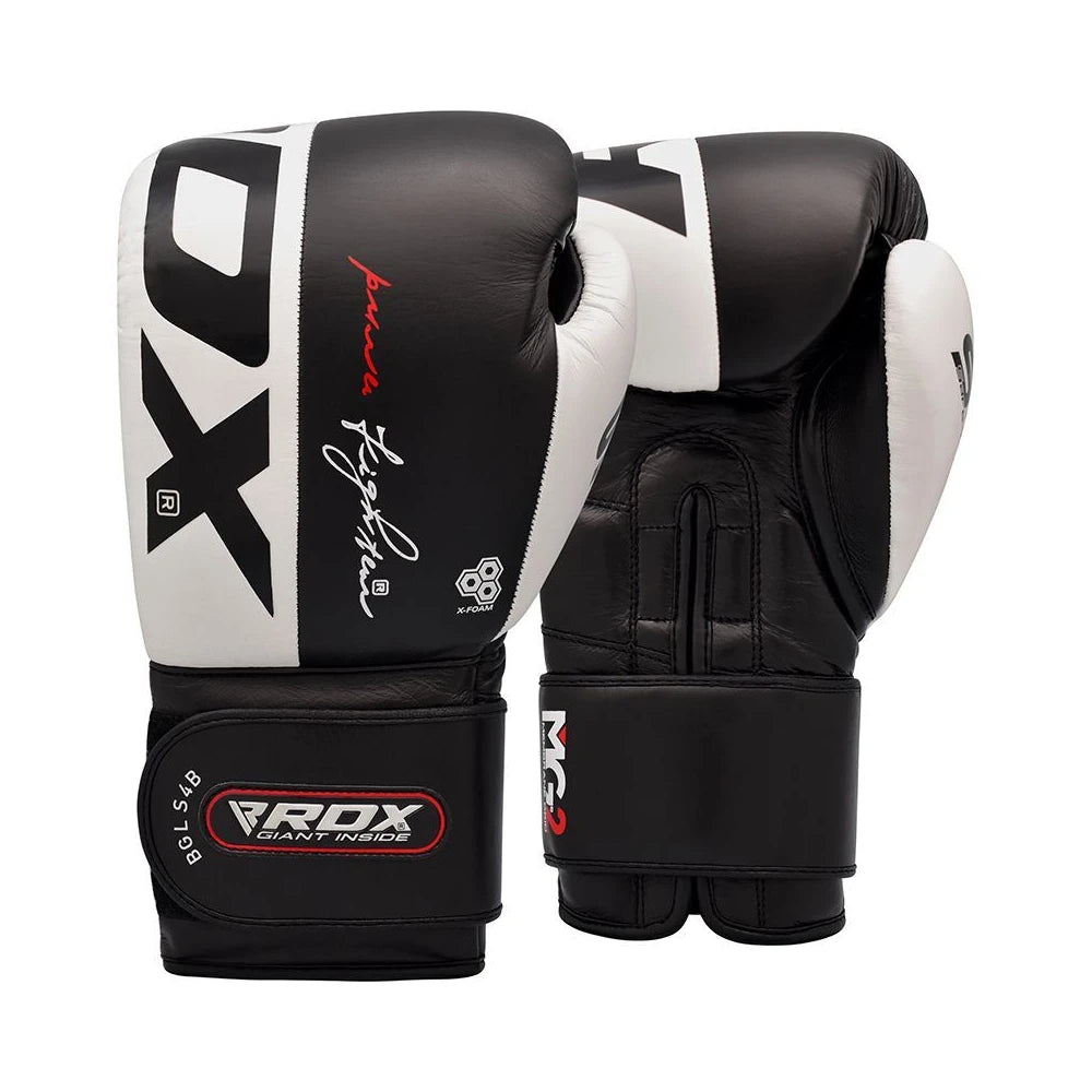 Pair of black and white boxing gloves with visible branding on a white background