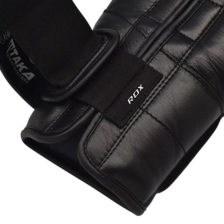 Black boxing gloves with ROX branding on a white background