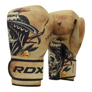 Pair of RDX boxing gloves with tribal design on a white background