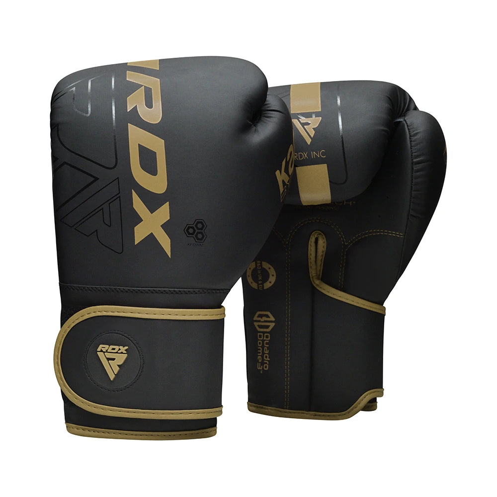 Black and gold boxing gloves with RDX branding on a white background