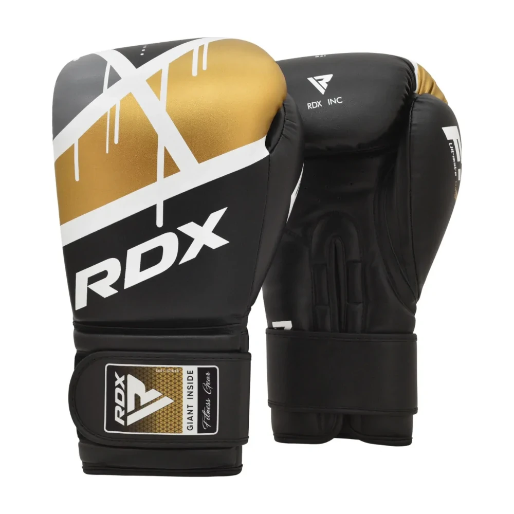 Black and gold boxing gloves with RDX branding on a white background