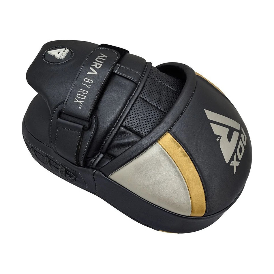 Black and gold boxing mitt with 'RDX' branding on a white background