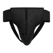Black groin guard with 'RDX' branding on a white background