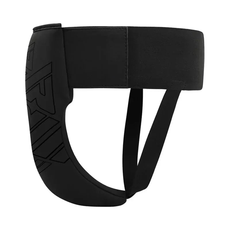 Side profile of a black groin guard with a RDX brand logo on a white background