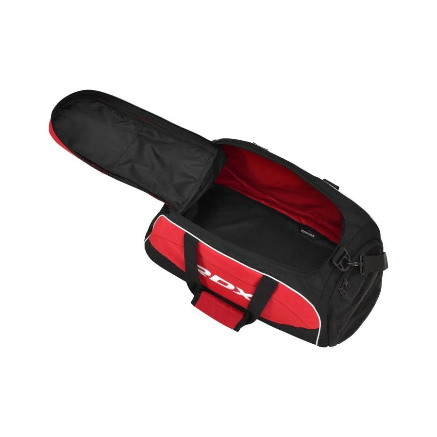 Open black and red duffel bag with visible RDX logo on a white background