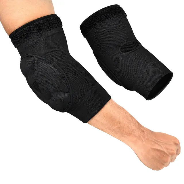 Black elbow pads on a person against a white background