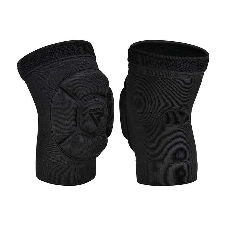 Pair of black knee pads with RDX logo on a white background