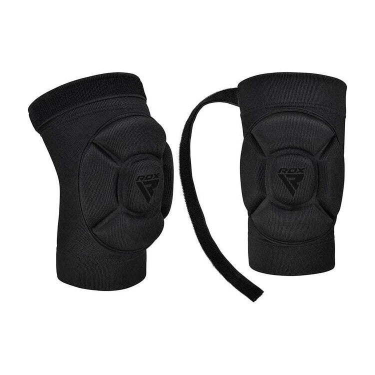 Pair of black knee pads with RDX logo on a white background