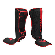 Black and red shin guards with 'RDX' branding on a white background
