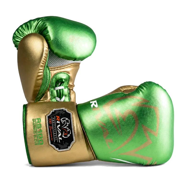 A pair of metallic green and gold boxing gloves on a clean white background. One glove is positioned upright, showing its gold cuff with a black and red logo patch, and the other is lying down, displaying its green fist with a gold graphic pattern.