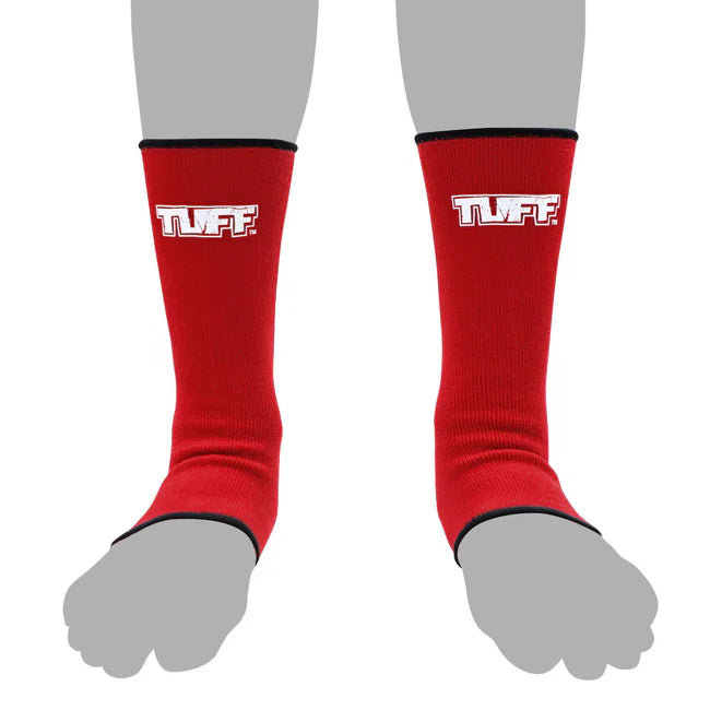 Red anklets with 'TUFF' logo worn on gray feet against a white background