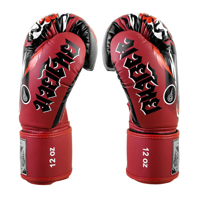 Red boxing gloves with black and white design on a white background