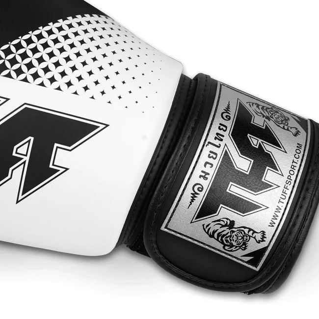 Close-up of a white and black boxing glove with brand logo on a white background