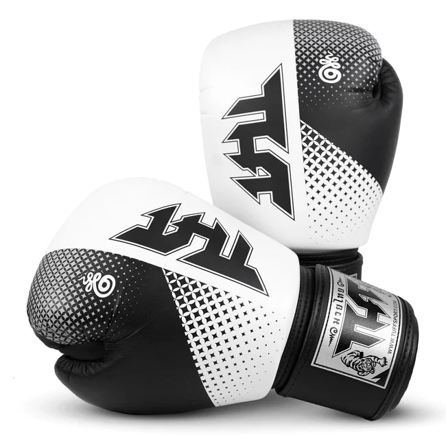 Pair of black and white boxing gloves with a brand logo on a white background