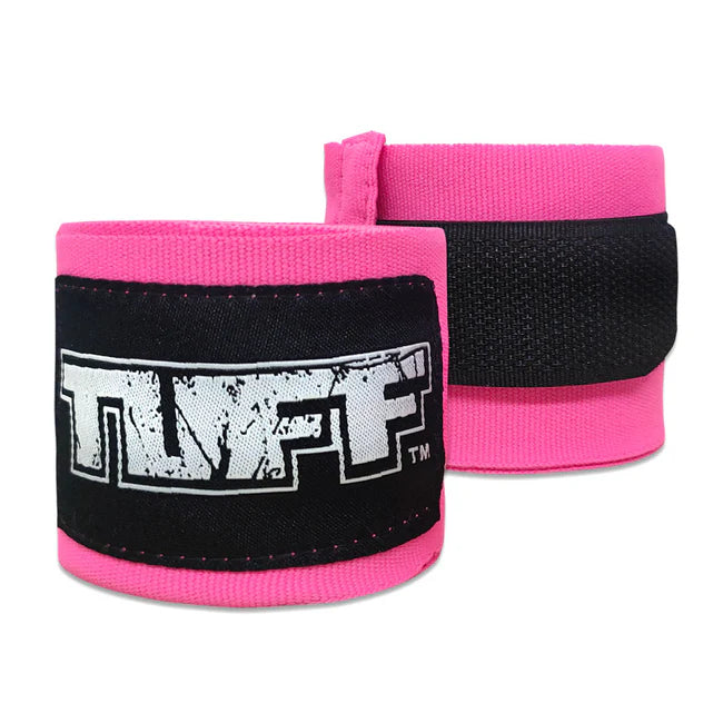 Pink wrist wraps with black straps featuring a logo on a white background