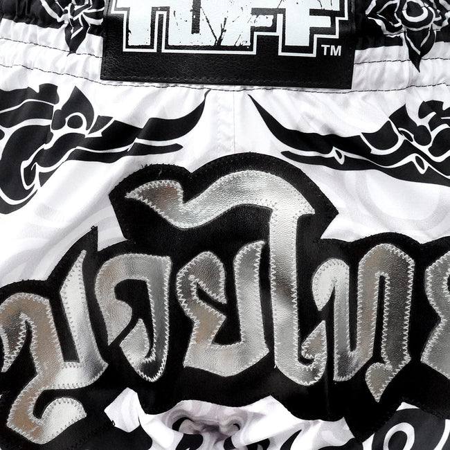 Close-up of a black and white patterned product with 'TUFF' branding.