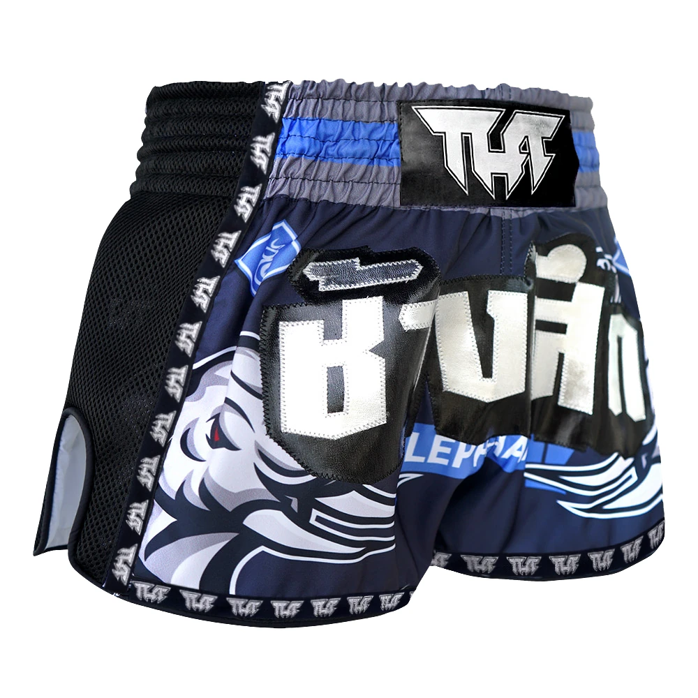 Pair of black and blue Muay Thai shorts with branding on a white background