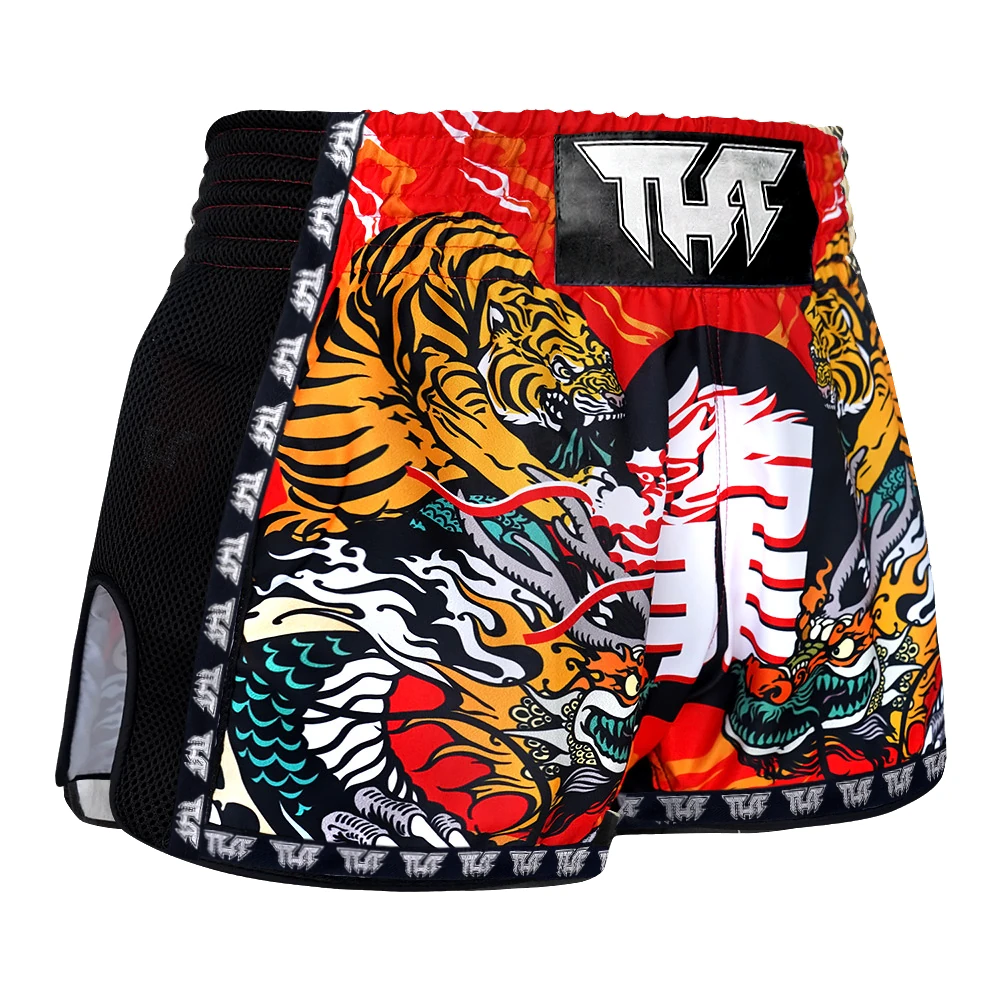 Colorful Muay Thai shorts with tiger design on a white background