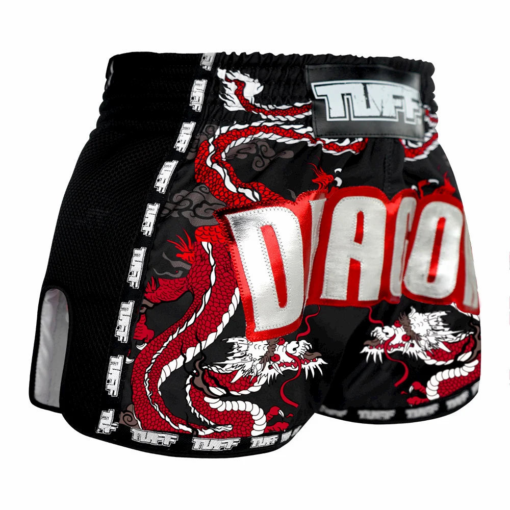 Black Muay Thai shorts with red and white dragon design on a white background