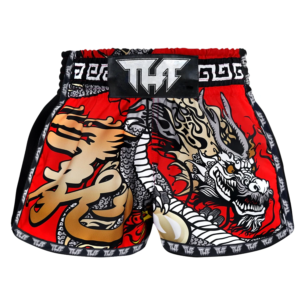 Red and black Muay Thai shorts with dragon design on a white background