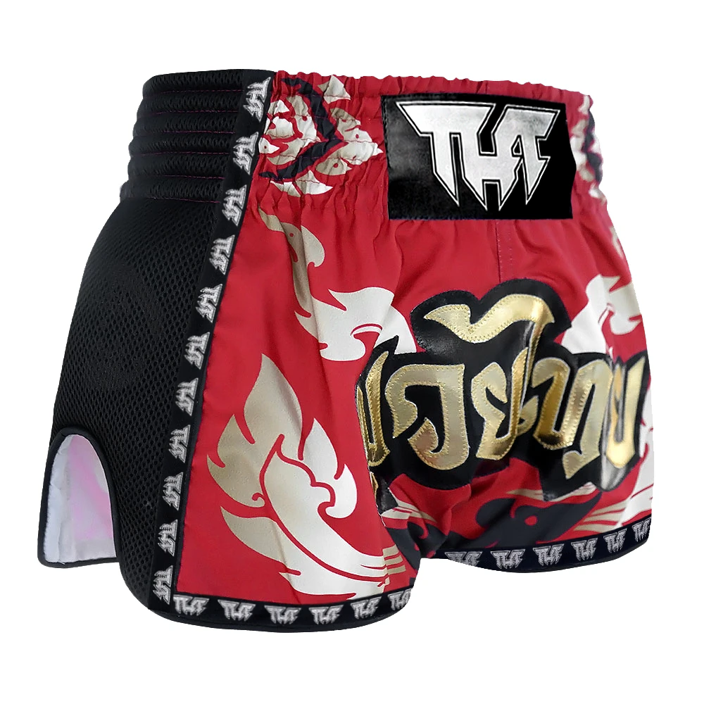 Red and black Muay Thai shorts with white designs on a white background