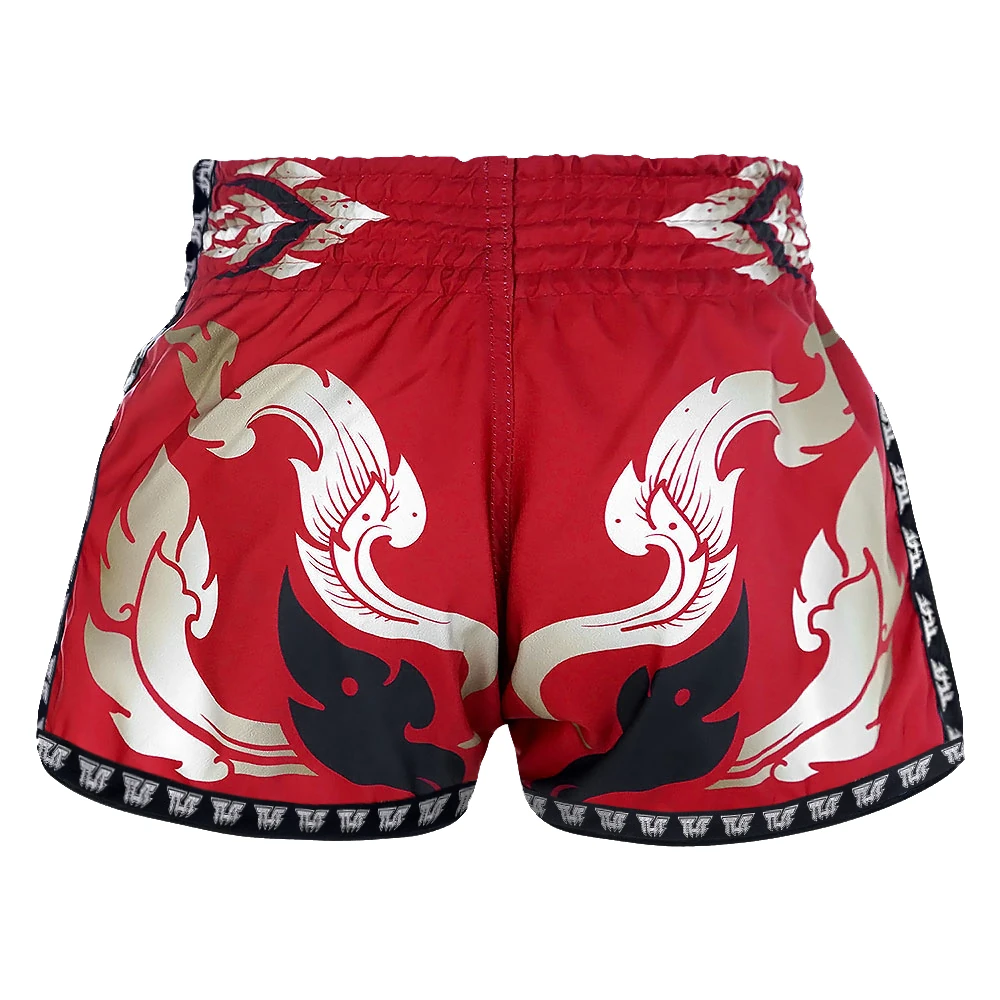 Red Muay Thai shorts with white and black dragon design on a white background