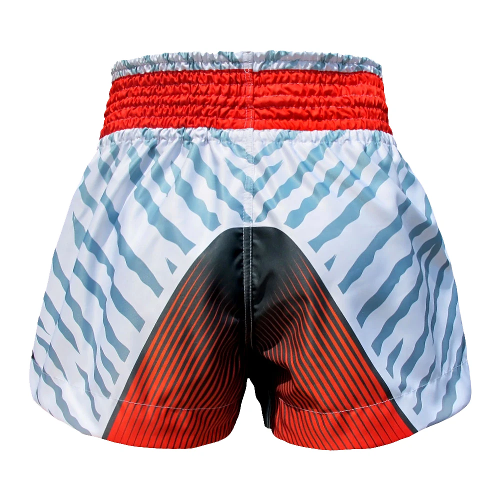 Muay Thai shorts with red waistband and black and blue pattern on a white background