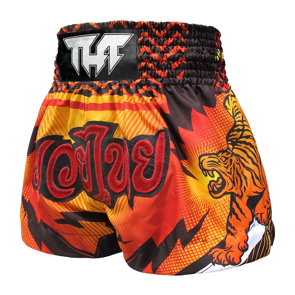 Colorful Muay Thai shorts with a tiger design and visible brand logo on a white background