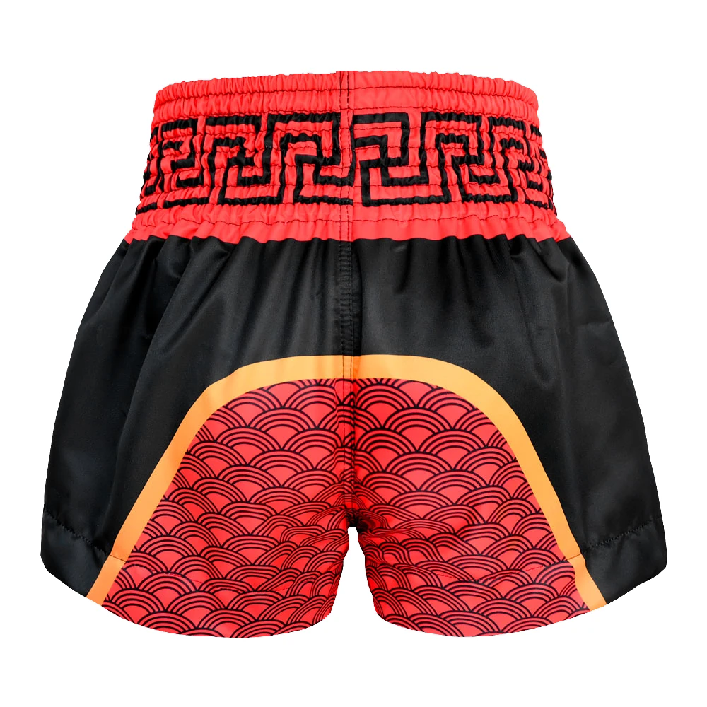 Black and red patterned Muay Thai shorts with a white background