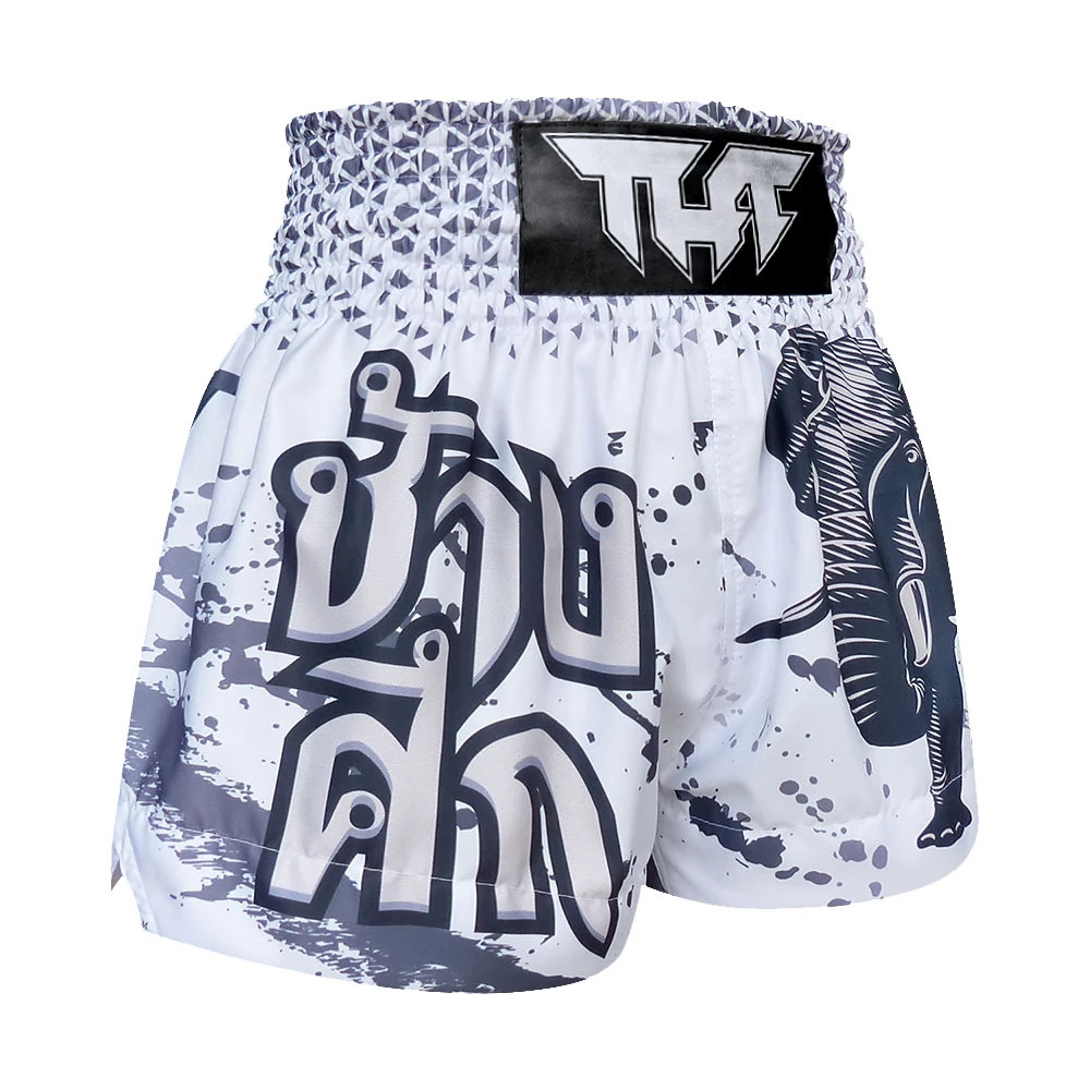 White and gray Muay Thai shorts with elephant design and brand logo on a white background