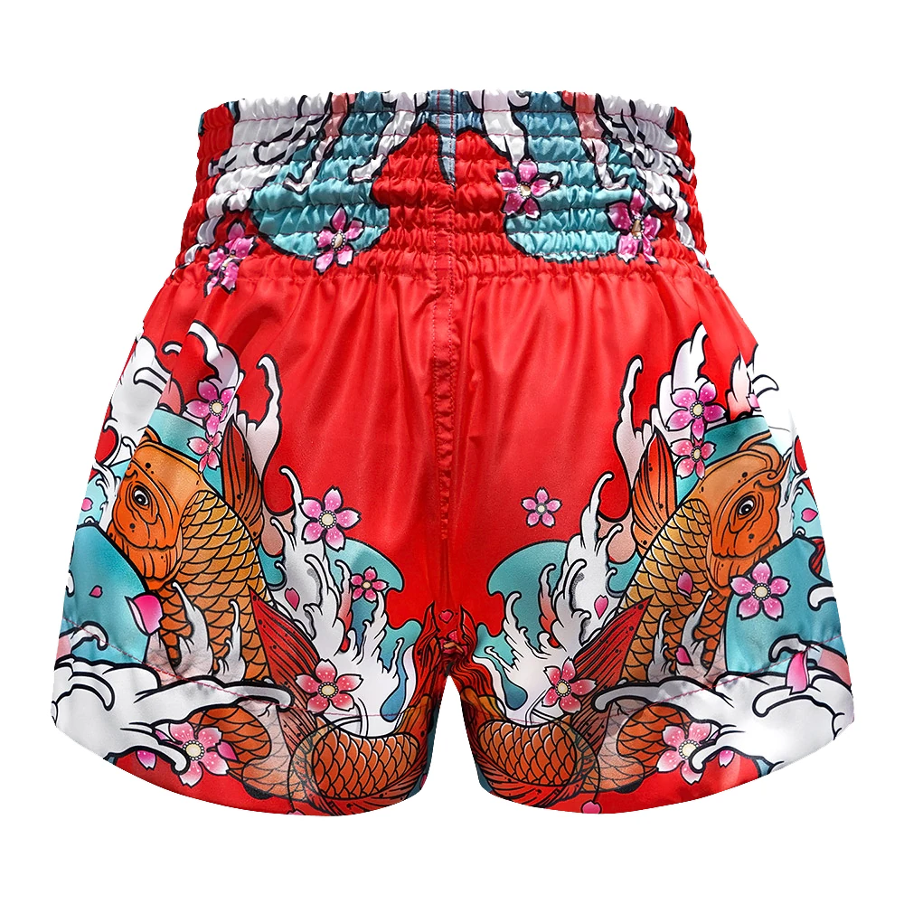 Red Muay Thai shorts with koi fish and floral design on a white background