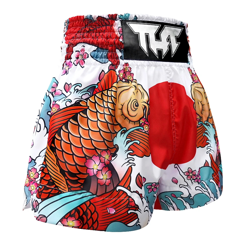 Muay Thai shorts with Koi fish and floral design on a white background