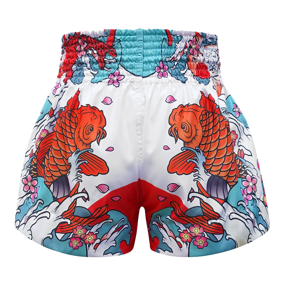 Colorful Muay Thai shorts with koi fish and floral patterns on a white background