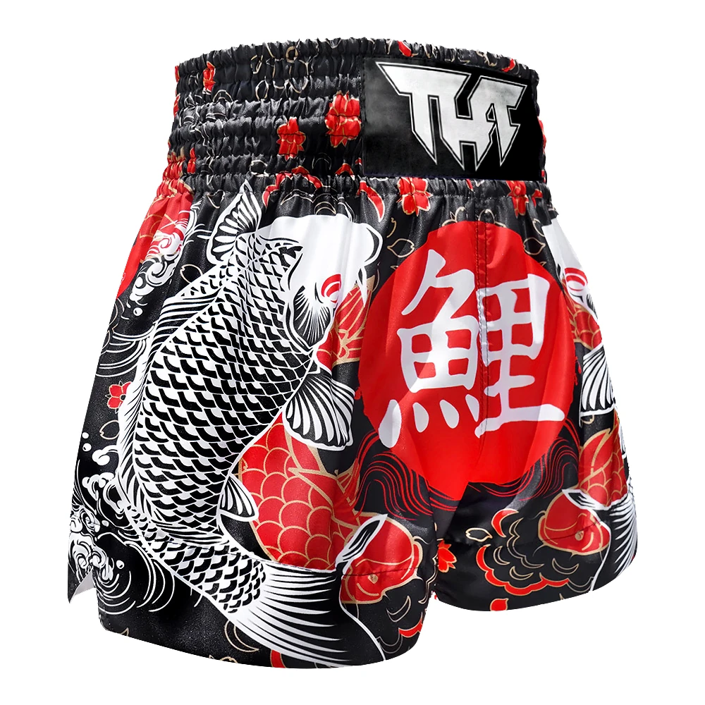 Traditional Japanese-themed thai boxing shorts with koi fish and kanji characters on a white background