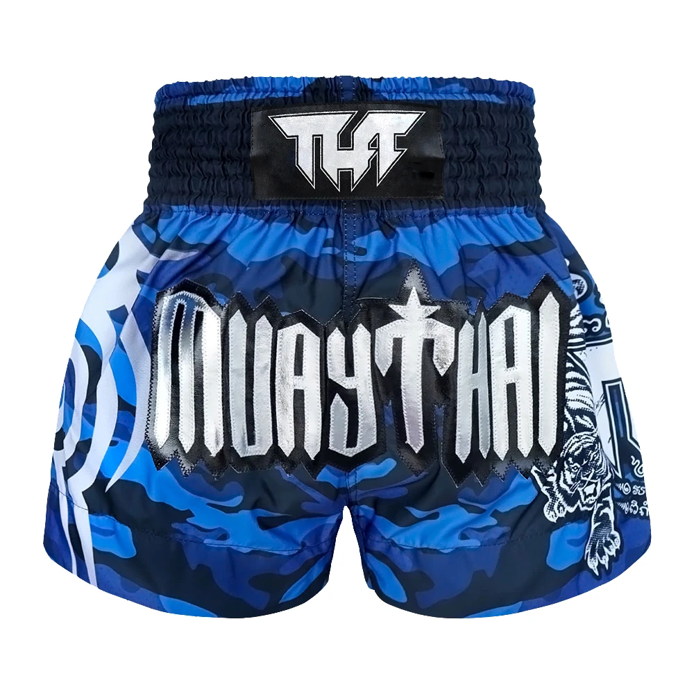 Blue and black Muay Thai shorts with white text on a white background