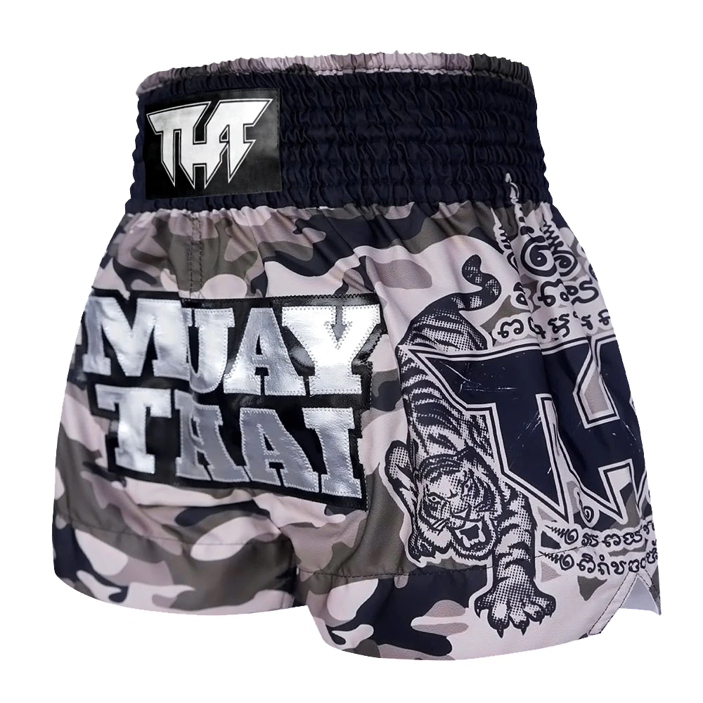 Camouflage Muay Thai shorts with tiger design and THF branding on a white background