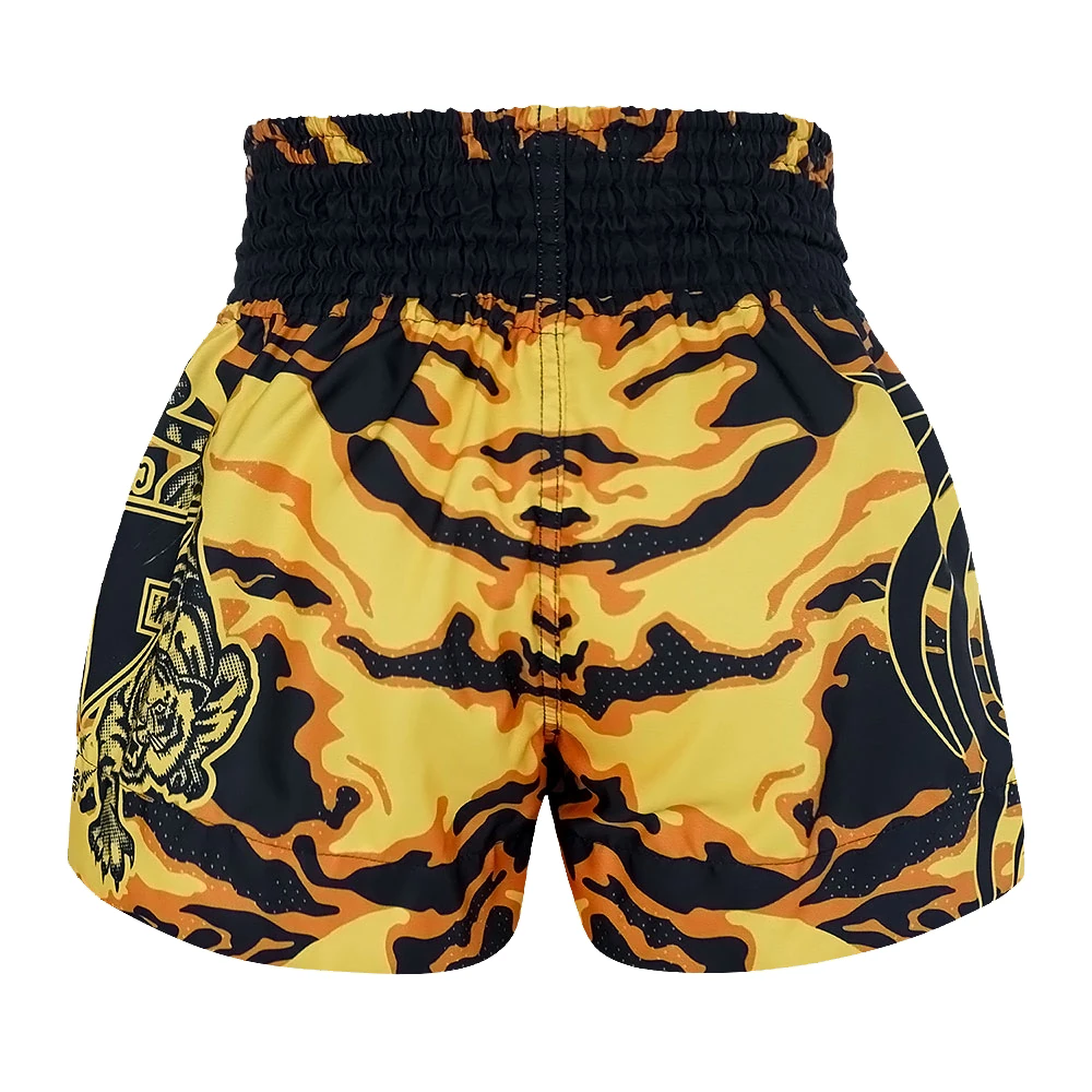 Yellow and black patterned thai shorts on a white background