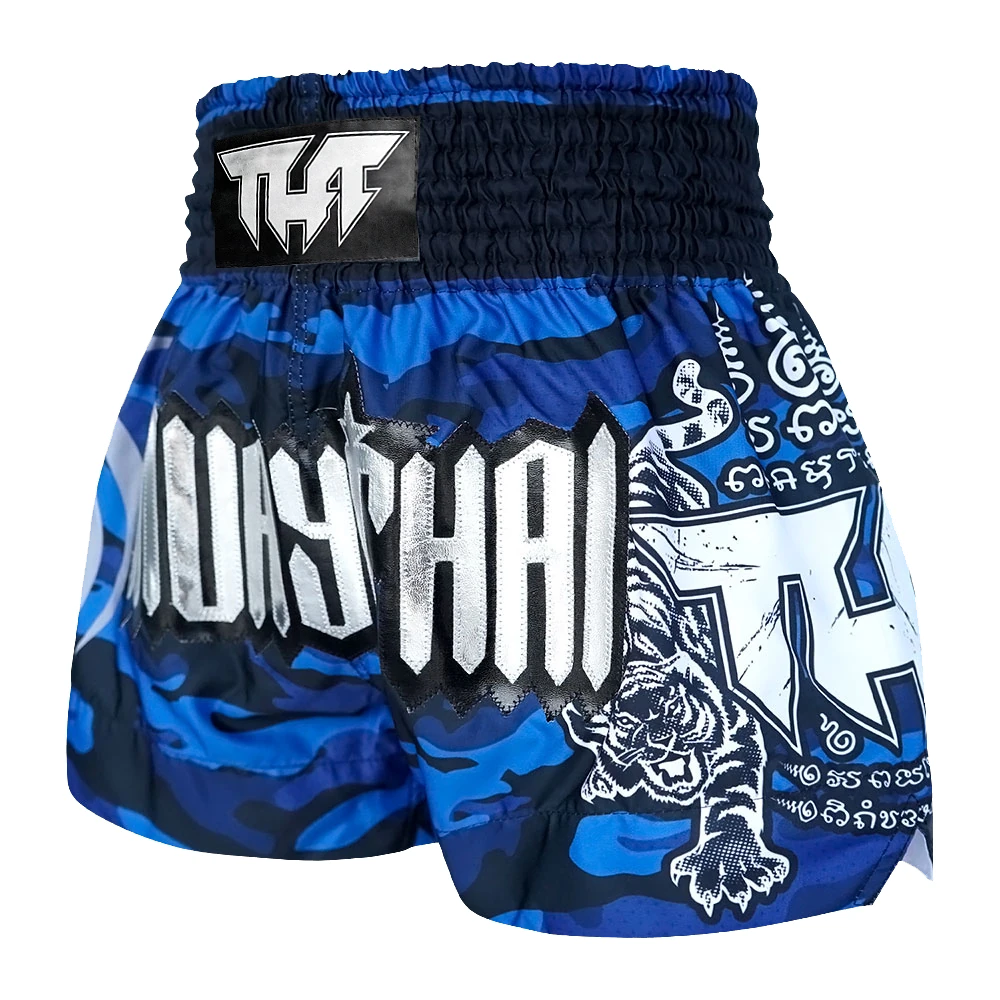 Blue and black Muay Thai shorts with white text and graphics on a white background